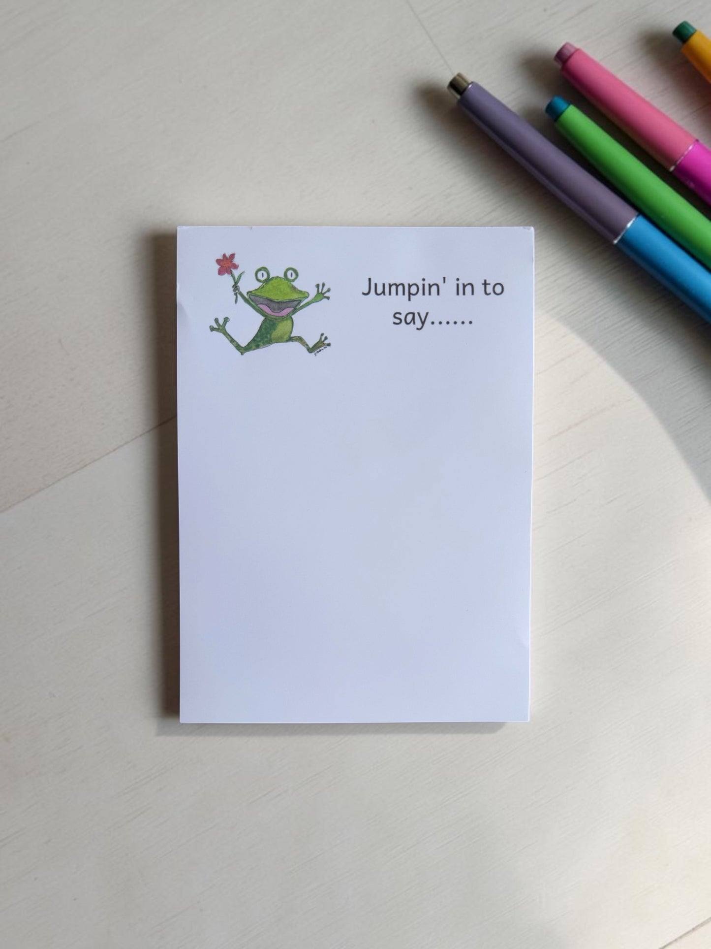 Frolicking frog notepad
