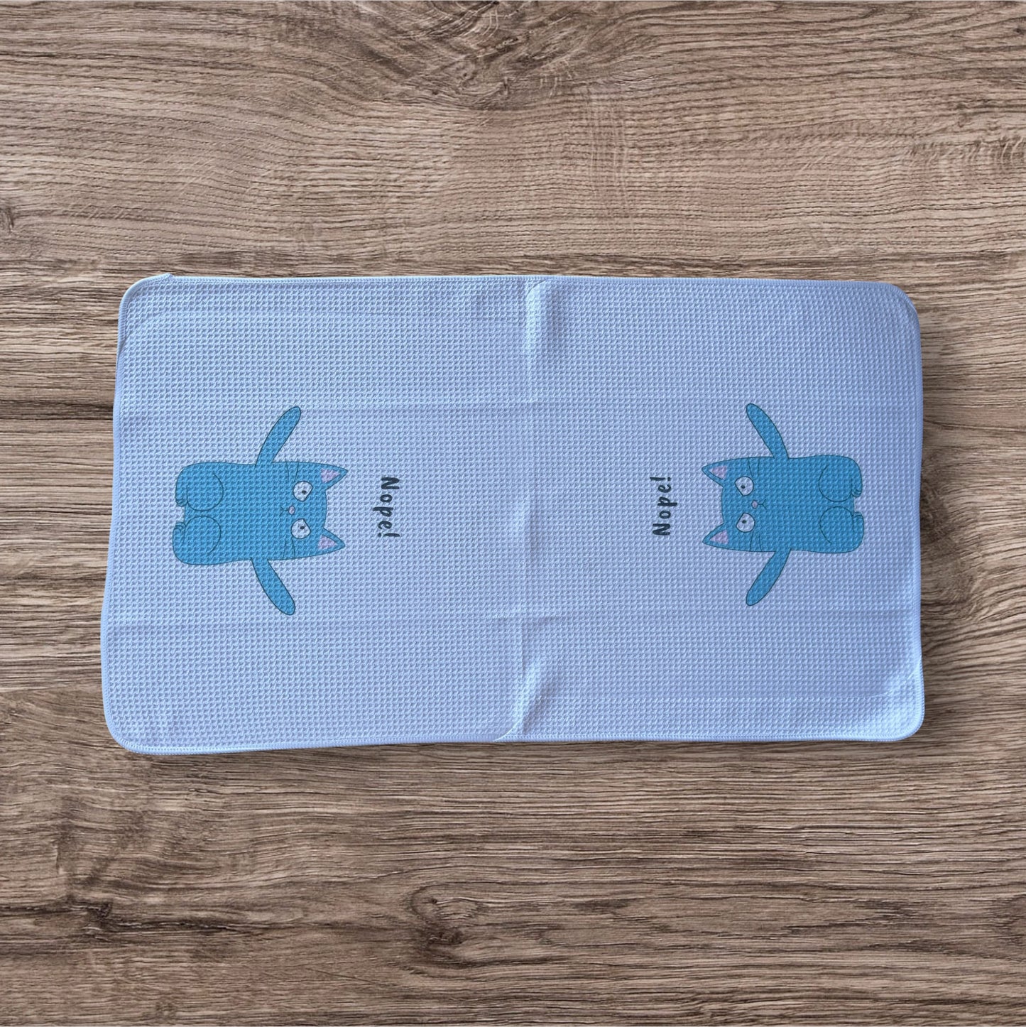 Nope! Cat dish towel