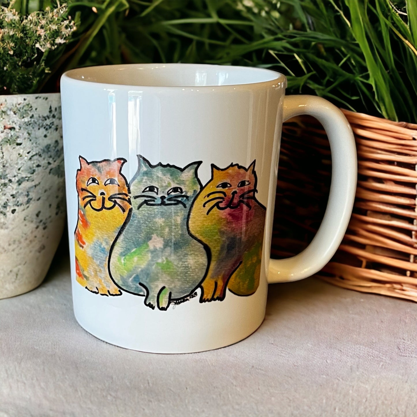 Three colorful cats mug